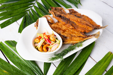 Deep fried Fish and green mango salad
