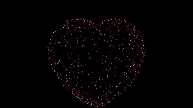 The red lights of the fireworks flash in the shape of a heart against a black background and go out very slowly until they disappear altogether.