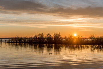 Fototapeta premium Sunset and Reflection at a Lake in Latvia