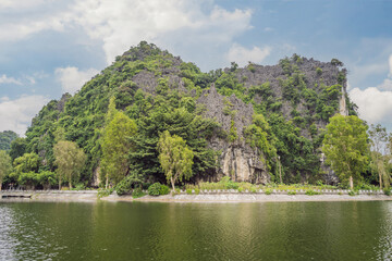 Fototapeta na wymiar Trang An, Tam Coc, Ninh Binh, Viet nam. It's is UNESCO World Heritage Site, renowned for its boat cave tours. It's Halong Bay on land of Vietnam. Vietnam reopens borders after quarantine Coronovirus