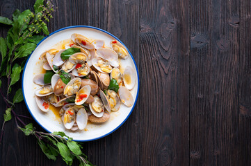 Stir fried Spicy Clam (Surf clam, Short necked clam, Carpet clam, Venus shell, Baby clam) with Thai Holy Basil