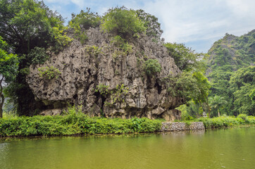 Obraz premium Trang An, Tam Coc, Ninh Binh, Viet nam. It's is UNESCO World Heritage Site, renowned for its boat cave tours. It's Halong Bay on land of Vietnam. Vietnam reopens borders after quarantine Coronovirus