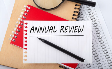 Word writing text ANNUAL REVIEW . Business concept on the table chart.