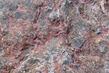 natural rock face, natural stone with veined and cracked surface texture,