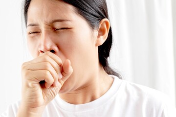 A woman has a cough, cold, sore throat, phlegm.