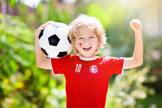 Denmark football fan. Danish kids play soccer.