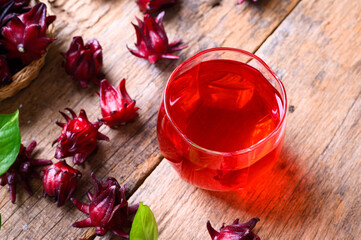 Roselle juice on wooden background, herbal organic tea for good healthy