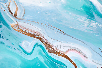 Acrylic Fluid Art. Waves in mint turquoise colors with liquid golden inclusion. Abstract marble...