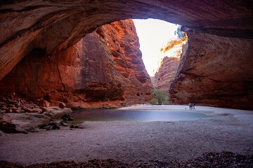 The large natural cavern of Cathedral Gorge with few people.