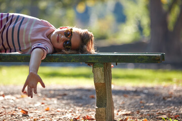 Child girl enjoying outdoors nature in the park.