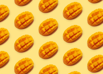 Trendy sunlight thai mango fruit isometric pattern on a pastel yellow background. Minimal hot summer or healty diet concept. Design wallpaper for banner headband flyer card. Flat lay.