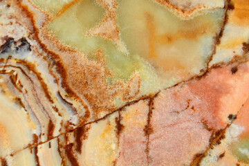 Onyx, the texture of a semi-precious stone. Cracks and streaks of pink, orange, brown, green whites...