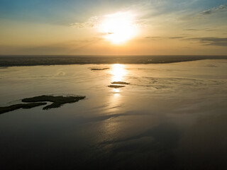 Sunrise over the wide river Dnieper. Aerial drone view.