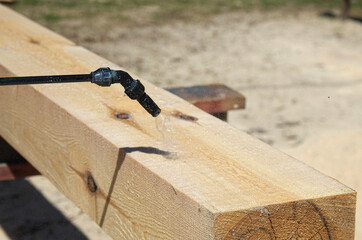 spraying wood preservative. protection of wood from mold. processing of timber with a chemical composition.