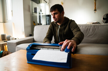 Blind man typing on typewriter with braille code