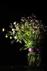 A bouquet of wild flowers in low key