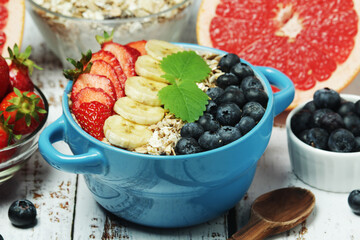 Healthy diet breakfast including cereal with berry and fruits