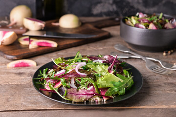 Plate with couscous and vegetables on wooden background