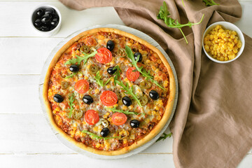 Board with tasty pizza on light wooden background