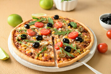 Board with tasty pizza and lime on color background