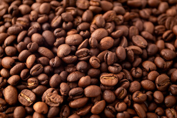 Fototapeta premium Coffee beans background. Roasted coffee fullframe. Texture of dark coffee beans.