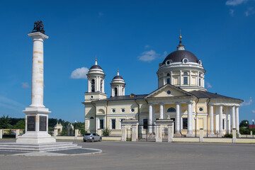 Fototapeta na wymiar View of Bibikovy family monument and Holy Spirit church (Svyato-Dukhovskaya church, late 18th century). Shkin’ village, Moscow Oblast.