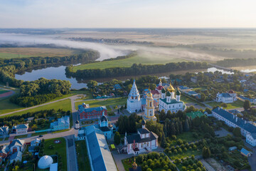Aerial view of the town, Novo-Golutvin monastery and Moscow river covered with mist. Kolomna, Moscow Oblast, Russia.