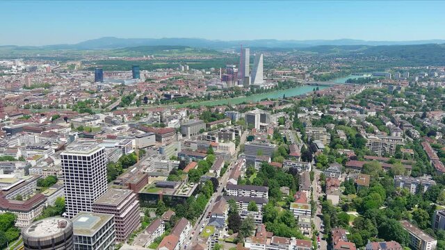 Basel: Aerial view of city in Switzerland at border with France and Germany, knee of river Rhine in center of city, clear blue sky - landscape panorama of Europe from above