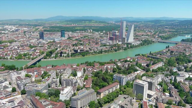 Basel: Aerial view of city in Switzerland at border with France and Germany, knee of river Rhine in center of city, clear blue sky - landscape panorama of Europe from above