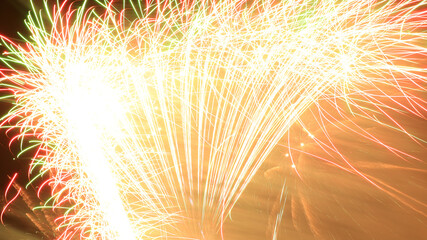 Firework.Beautiful display of colorful fireworks on a night sky background.Light abstract