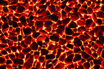 Smoldering charcoal in a burning stove. The texture and pattern of a natural mineral. Red fire background.