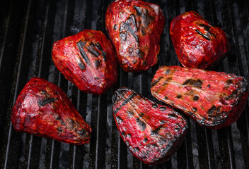 Cooking new red beetroot in charcoal grill