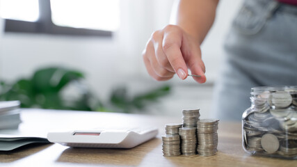 Saving money for Real estate investment with stack of money coins for buy home and loan for prepare in future financial insurance. Accountant verify growing business concept