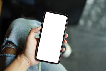 Women's hands holding cell telephone blank copy space screen. smart phone with technology concept