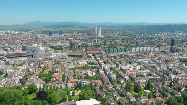 Basel: Aerial view of city in Switzerland at border with France and Germany, city outskirts with modern residential buildings, clear blue sky - landscape panorama of Europe from above