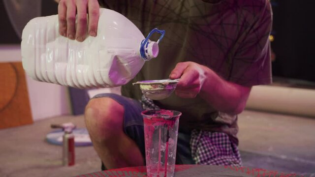 A talented painter is filtering paints 