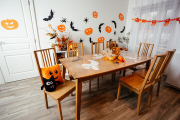 Wooden dining table decorated for Halloween party