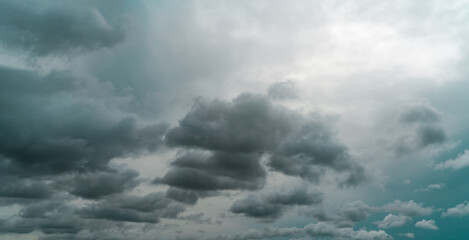 Panorama view of overcast sky. Dramatic gray sky and dark clouds before rain in the rainy season....