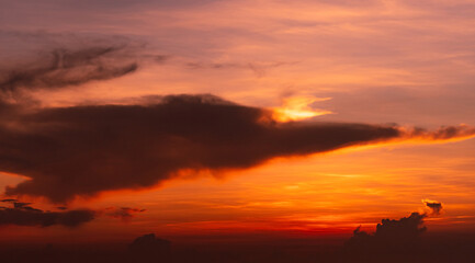 Dramatic red and orange sunset sky and clouds abstract background. Red-orange clouds on sunset sky. Heaven sky. Sunset abstract background. Dusk and dawn concept. Romantic sky. Beauty in nature.