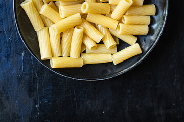 pasta is ready to eat macaroni ziti or penne main course italian cuisine on the table healthy food meal snack copy space food background rustic. top view