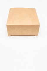 Brown cardboard box, white background, copy space, top view, vertical