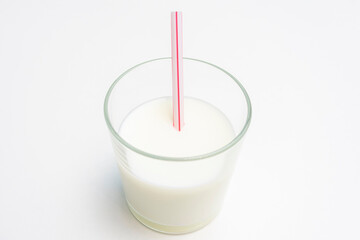 One glass of fermented cocktail milk drink, white background, cropped image, close-up, copy space, top view
