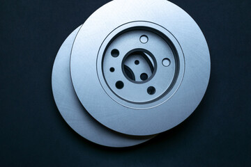 Part isolated. New metal car part. Auto motor mechanic spare or automotive piece isolated on black background. Technology of mechanical gear with space for text.