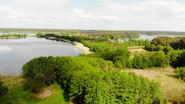 Lake With Vegetated Shore At Nature Reserve Near Styporc Village In Northern Poland. - Aerial Drone Shot