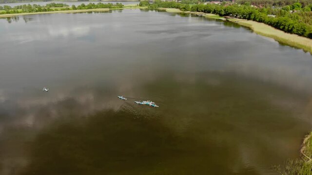 Tourists Kayaking On Pristine Lake On National Park Near Styporc, Pomeranian Voivodeship In Northern Poland. - Aerial Shot