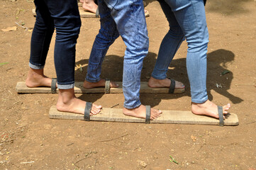 Fototapeta premium Bakiak Race - Bakiak is the long sandals made of wood used in Indonesia's independence celebration competition