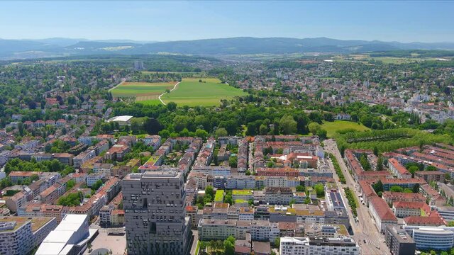 Basel: Aerial view of city in Switzerland at border with France and Germany, city outskirts with modern residential buildings, clear blue sky - landscape panorama of Europe from above