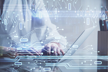 Double exposure of woman hands working on computer and data theme hologram drawing. Tech concept.