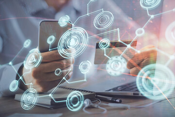 Double exposure of man hands holding a credit card and social network theme drawing. Digital finance and E-commerce concept.