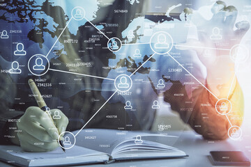 Multi exposure of woman on-line shopping holding a credit card and social network theme drawing. Relationship E-commerce concept.